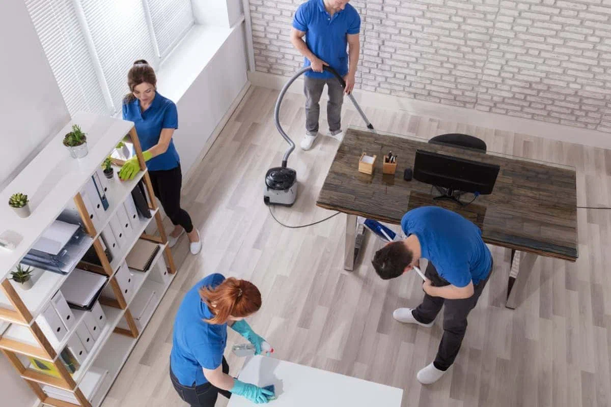 Professional commercial office cleaning service provided by cleaning service worker steam deep cleaning of commercial office space in Manhattan.